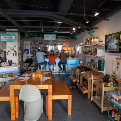 Interior, seating table with a bar in the back.