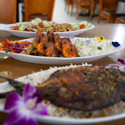 View or the various dishes with sides lined on the table.