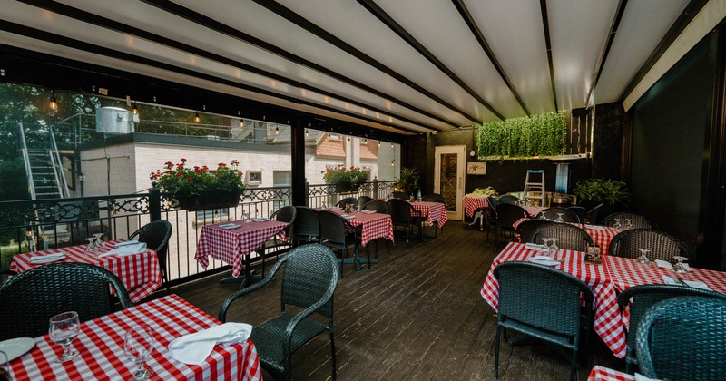 Covered terrace with chairs and tables