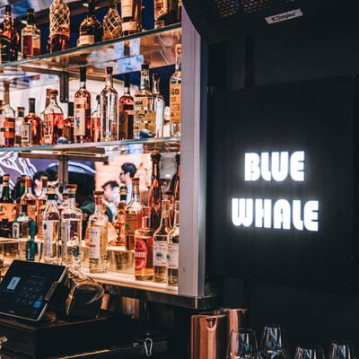 Various liquor bottles on the shelf.