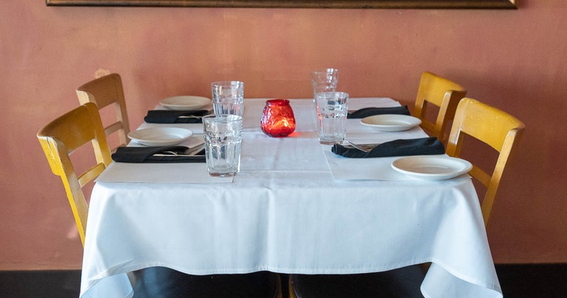 Table for four set and ready for guests