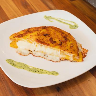 Corn dough sandwich with grilled cheese.