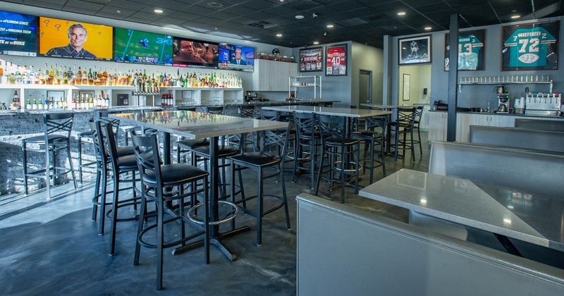 Interior, seating area with high seating chairs and tables