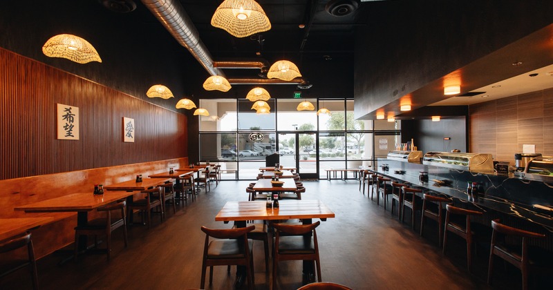 Diner area, tables, chairs, wide view to side walk window and entrance