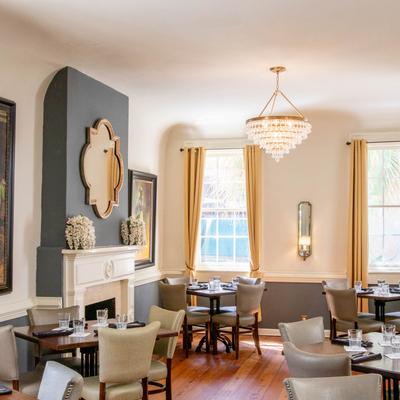82 Queen interior, dining room space with elegant decor and set tables