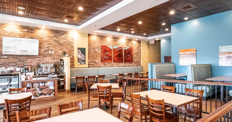 Chairs and tables near bar area