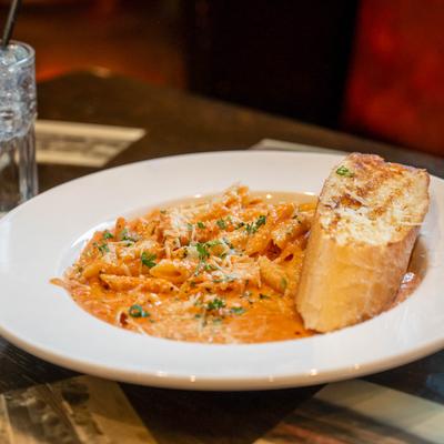Penne pasta in pink vodka sauce.
