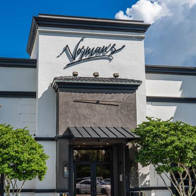 Exterior, restaurant front entrance and sign above the door.