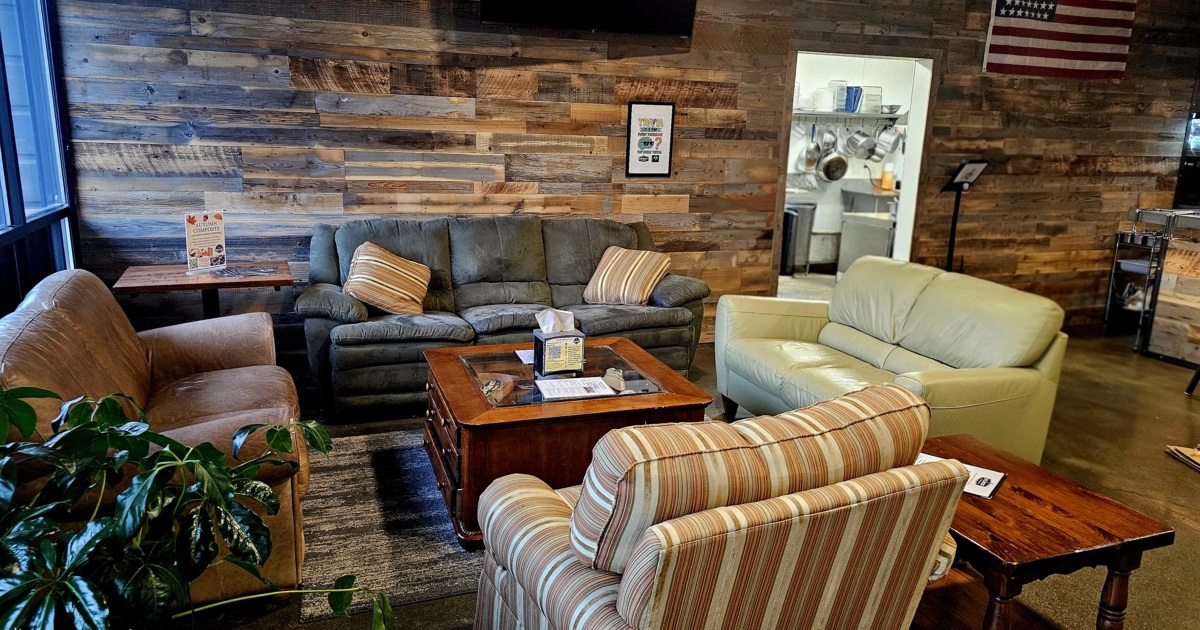 Lounge are with couches, comfy chairs, coffee table and side tables