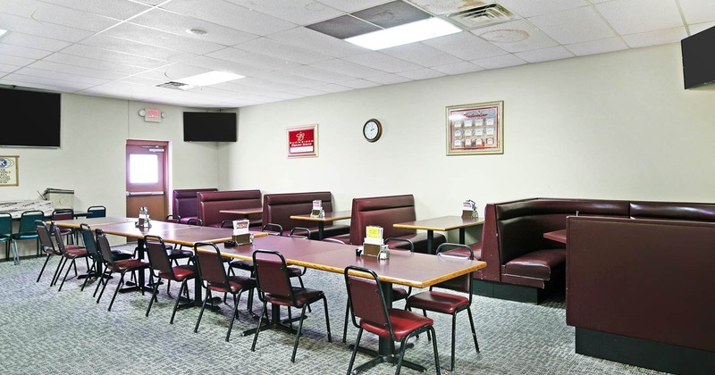 Interior, dining area, tables, chairs, and leather booths