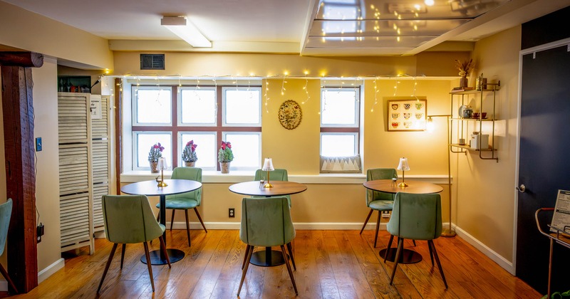 Interior, tables and chairs near window