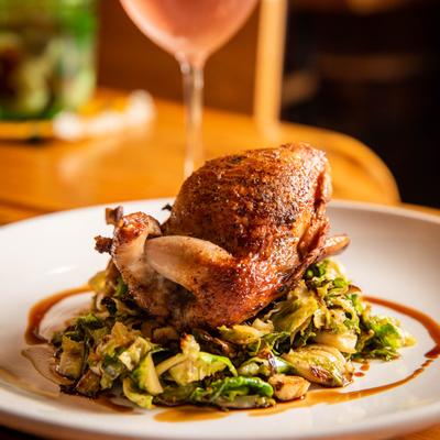 Roasted whole quail with Brussels sprouts