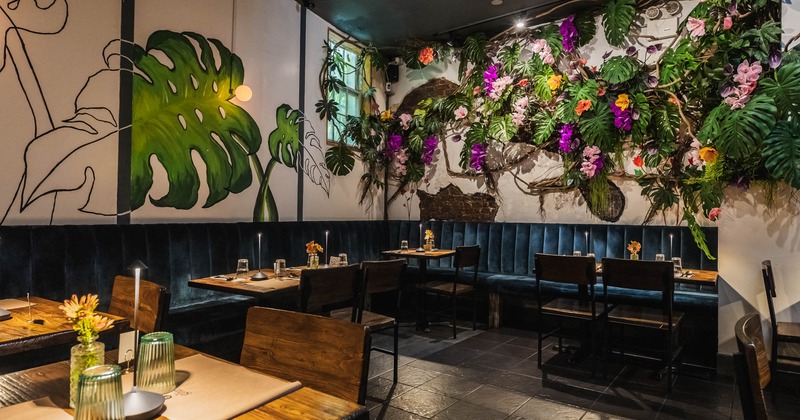 Dining area with flowers and leafs on the walls