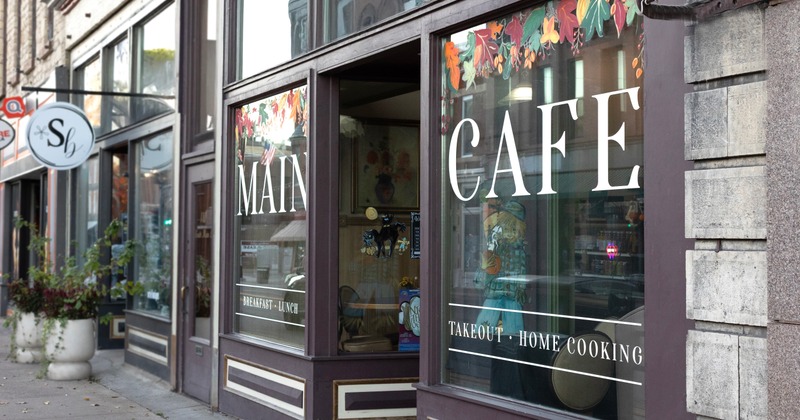 Exterior, angle view on entrance to cafe and part of side walk