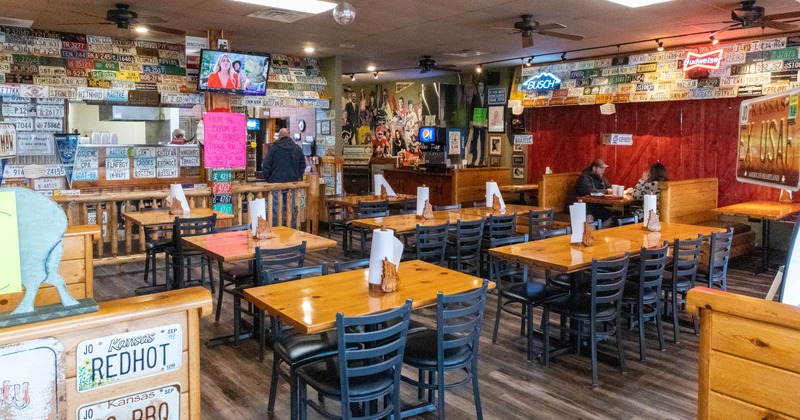 Interior, two guests sitting and one guest waiting for dish