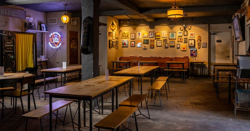 Interior, seating area, tables and chairs, framed pictures on the wall