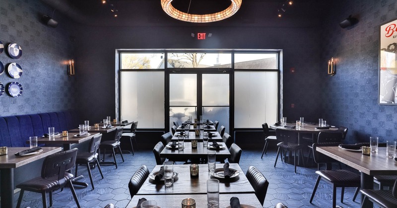 Interior, dining area, tables ready for guests, hexagonal tile flooring, emergency exit