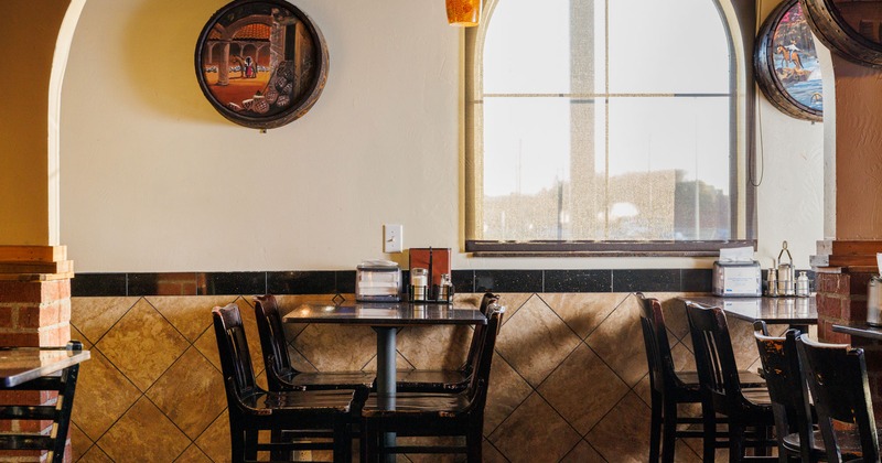 Interior, tables and chairs by the window