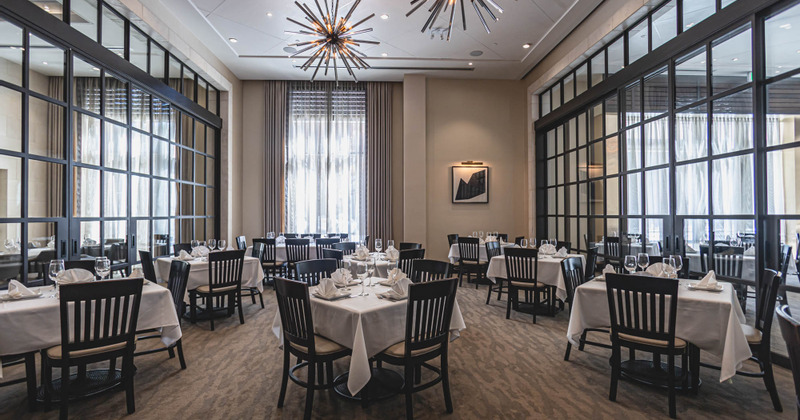 Tables for four ready for guests