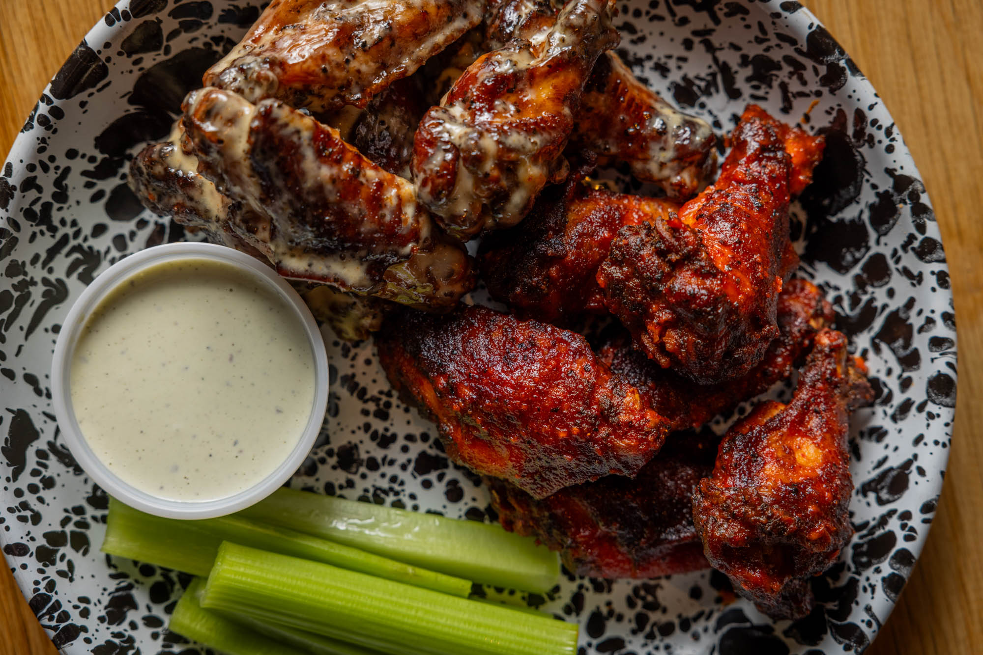 Smoked chicken wings, celery, and blue cheese dressing