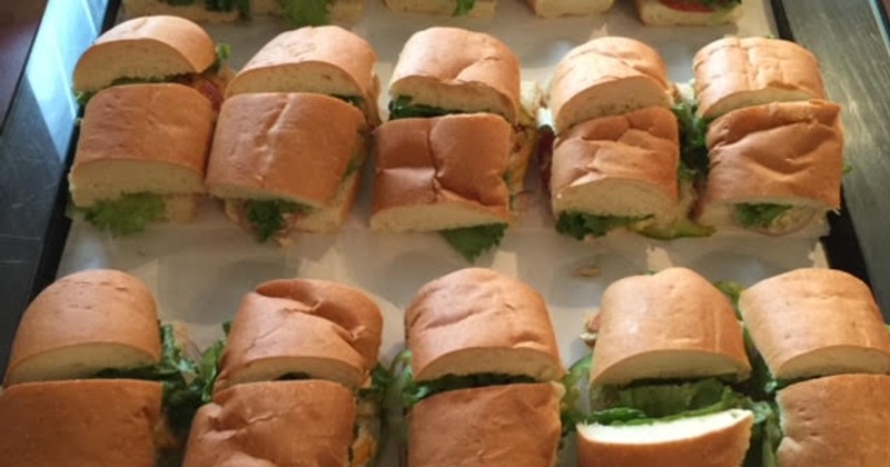 Sub sandwiches with lettuce on a tray