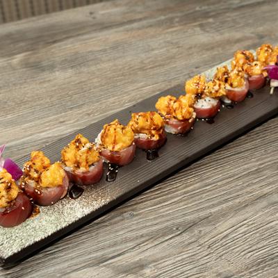 Crab and shrimp tempura rolls, wrapped in tuna.