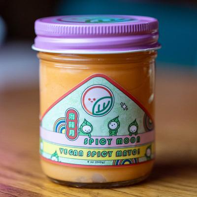 A sealed jar of vegan spicy mayo.