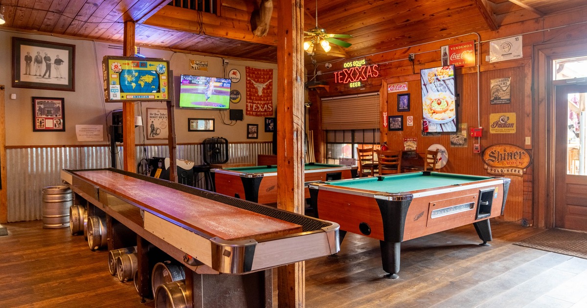 Interior, room with pool tables and other games