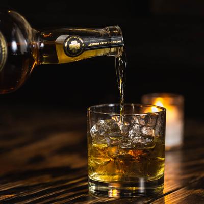 Pouring Irish whiskey in a glass.