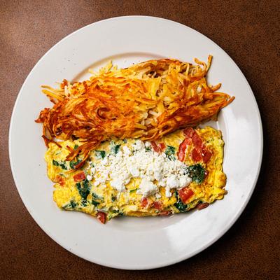 Greek omelet with hash browns.