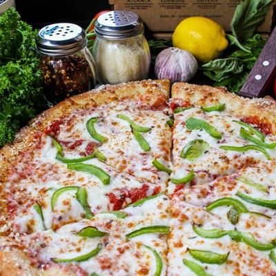 Cheese pizza topped with green bell peppers