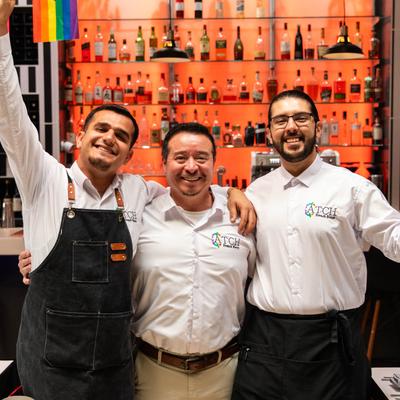 Staff members in the bar setting, portrait shot.