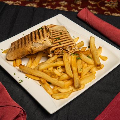 Chicken shawarma sandwich and fries.