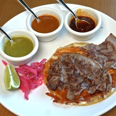 Steak taco with sauces.