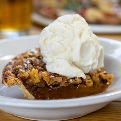 Walnut-chocolate pie with whipped cream.