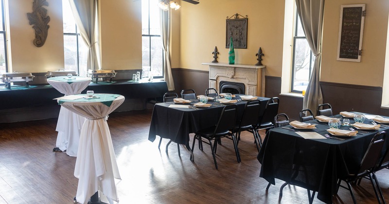 Interior, a banquet room with tables and chairs set up for an event
