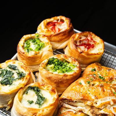 Tray of Veggie Stromboli filled with broccoli, spinach and eggplant.