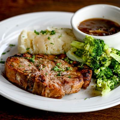 Pork Chop, mashed potato, broccoli and beef au jus.