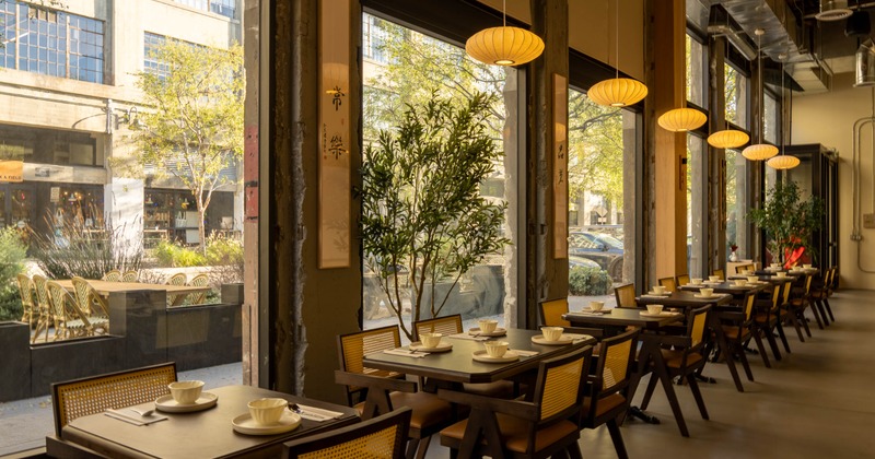 Interior, tables and chairs next to the windows