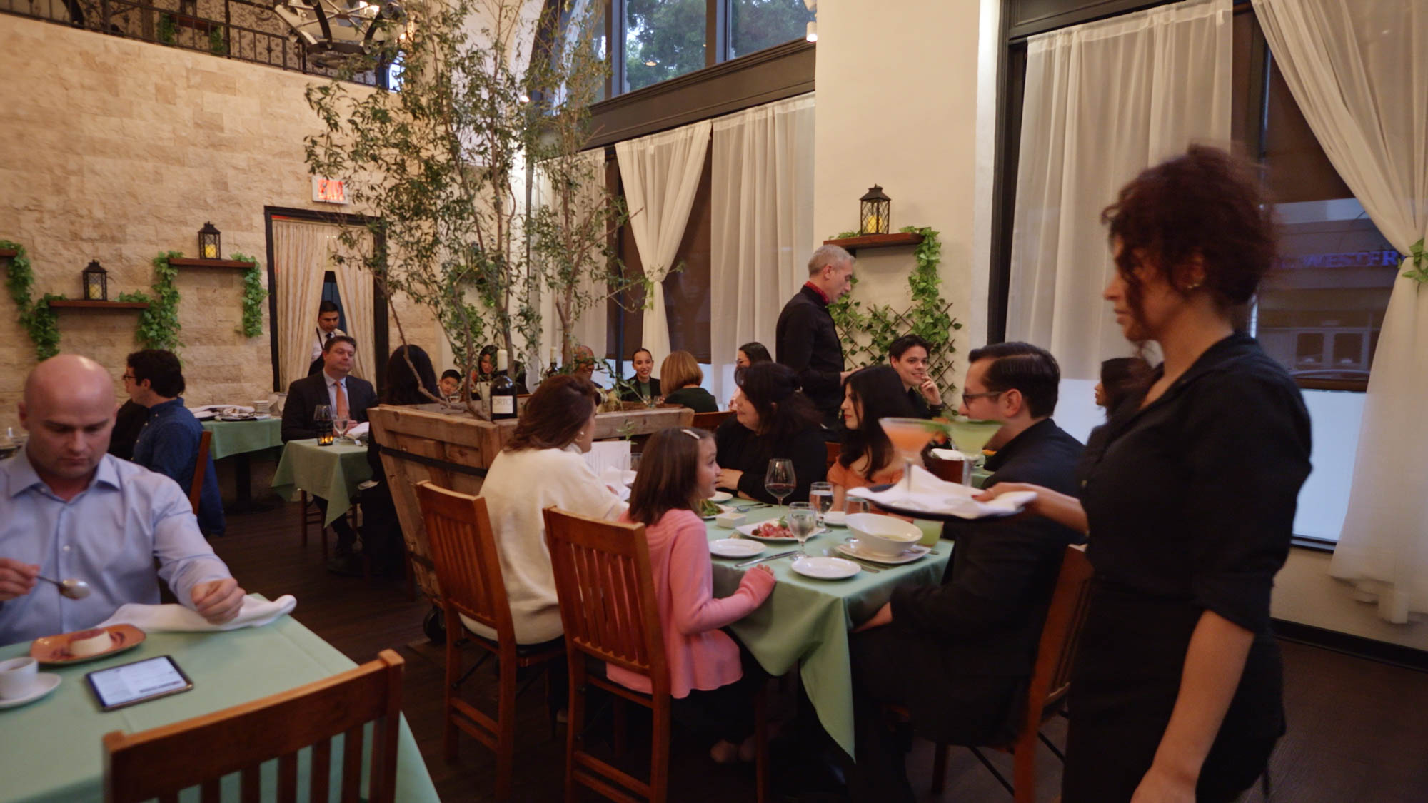 Family enjoying dinner inside restaurant