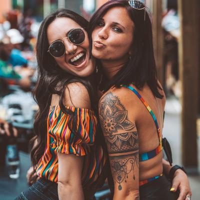 Two guests posing for the photo