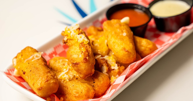 Fried mozzarella bites served with marinara sauce