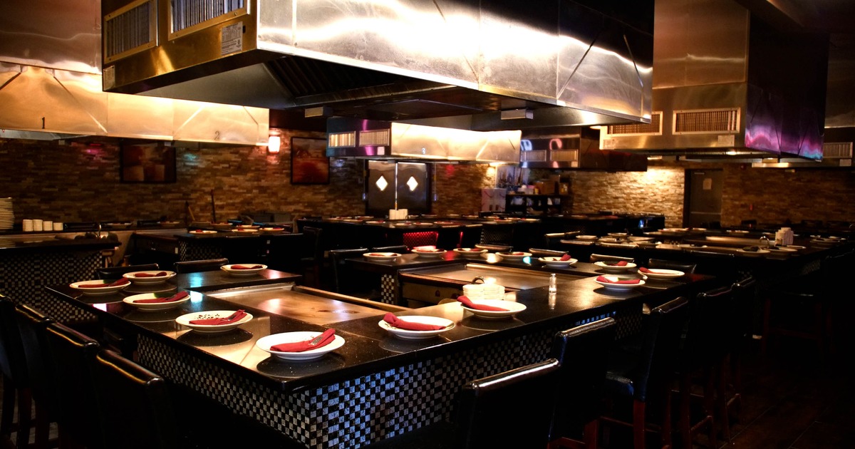 Interior, dining area, hibachi tables and grills with chairs