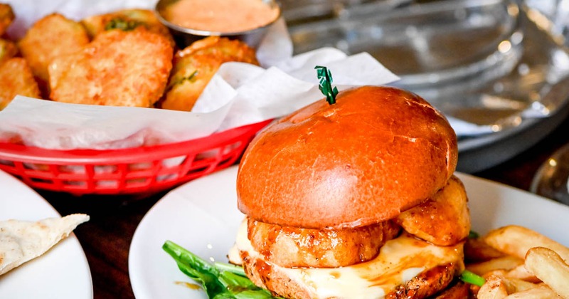 Veggie burger with other food in the background