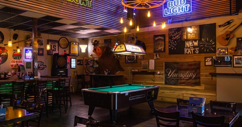 Dining area with pool table in the middle