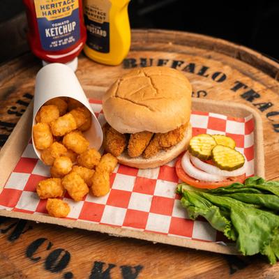 Chicken tender sandwich and tater tots.