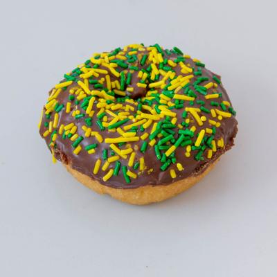 Cake donut topped with chocolate glaze and sprinkles.