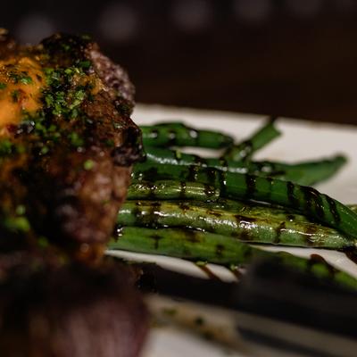 Grilled steak with herb butter, asparagus, and balsamic.