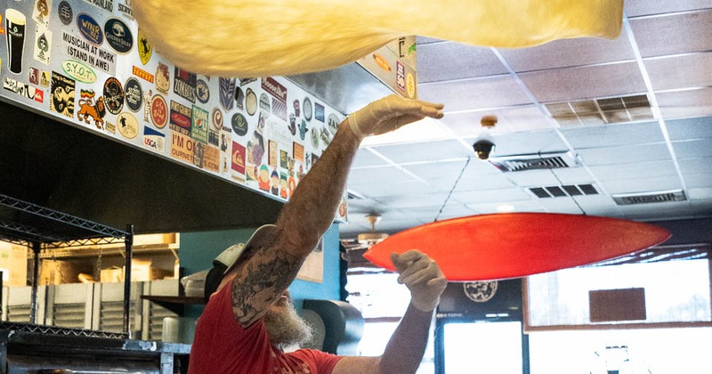 Chef throwing pizza dough in the air