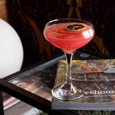 Side view of a Hibiscus Bees Knees cocktail